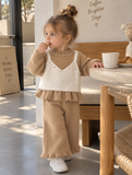 The Texture: Ultra-plush, non-shedding, cloud-soft fuzzy knit.The Details: Pearl & rhinestone collar embellishments, elegant ruffle borders, layered look.Best For: Birthday parties, winter festivities, and high-end family portraits.