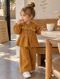 Get your little girl the coziest 2-piece peplum knit set with elegant pearl drops and a beautiful statement bow. Soft, warm, and absolutely adorable! 🛍️👶Available in Mustard Gold and Sage Grey. DM us to order now! 📩