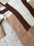 Eatures functional front buttons, a tailored polo collar, and ribbed elastic cuffs designed to trap heat and block out winter chills.