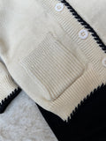 Fabric: Premium Soft Acrylic-Cotton Blend (Completely itch-free and gentle on skin)Items Included: Scallop-Edge Button Cardigan, Matching Black Knit Trousers