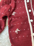 The classic button-down front makes layering quick and effortless, preventing the fuss of pulling tightly fitted sweaters over a toddler’s head